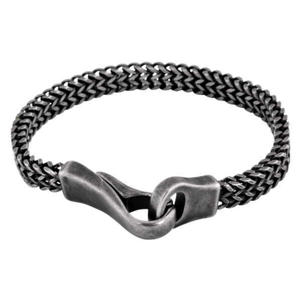 Brazalete negro de acero quirúrgico con acabado mate sobre fondo blanco