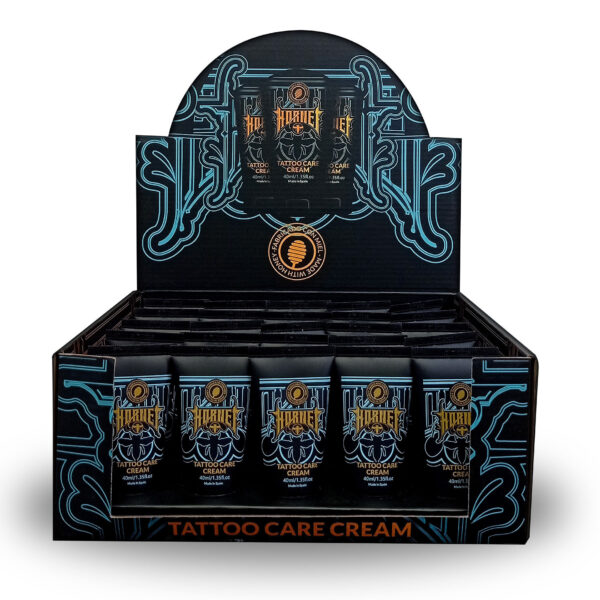 Caja negra con tubos de Crema de Cuidado para Tatuajes Hornet y decoraciones azules