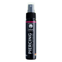 Wildcat Spray para Cuidado de Piercings 30ml Botella de spray negra con el logo de Wildcat, inscripción 'Spray para cuidado de piercings', 30ml