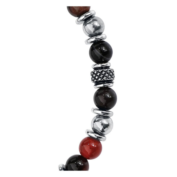 Pulsera de acero quirúrgico con piedras negras y rojas sobre fondo blanco