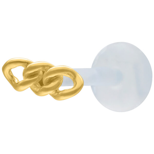 Labret dorado con diseño de cadena sobre fondo blanco