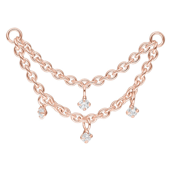 Cadena de piercing de dos capas en oro rosa con cristales claros sobre fondo blanco