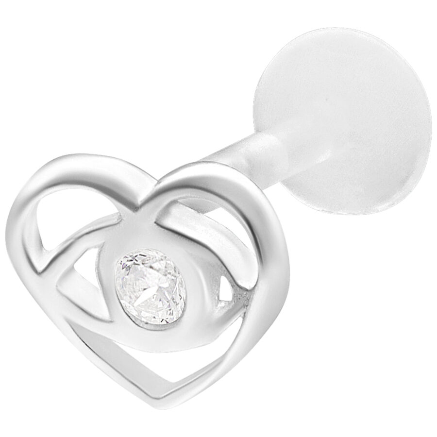 Labret piercing plateado con forma de corazón y piedra clara sobre fondo blanco