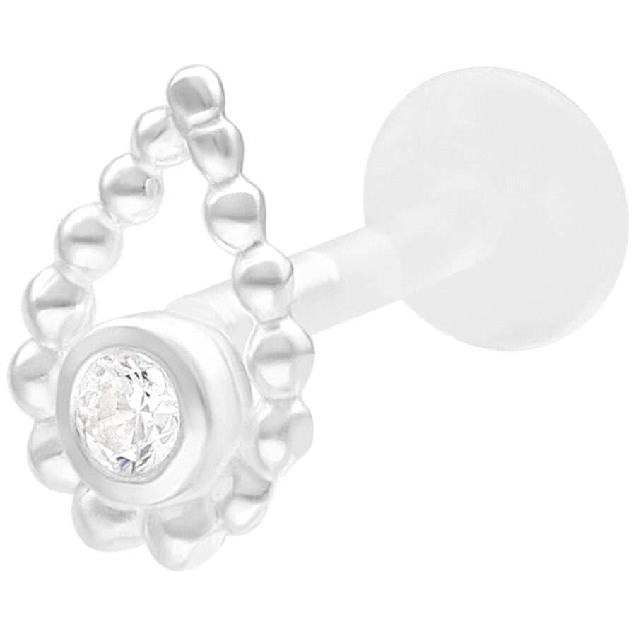 Labret plateado con anillo de perlas y piedra sobre fondo blanco