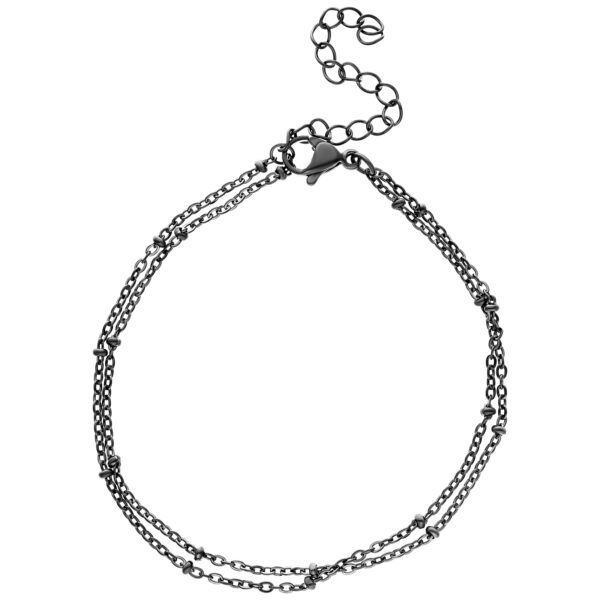 Pulsera doble negra de acero quirúrgico con perlas sobre fondo blanco