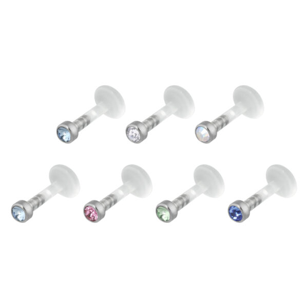 Seis Labrets Push-Fit con cristales de varios colores sobre fondo blanco