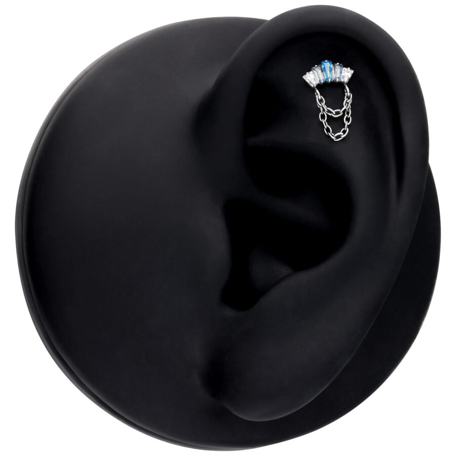 Accesorio Push Fit plateado con cristales lavanda y turquesa en exhibidor de oreja negro