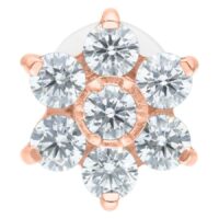 Labret mit roségoldener Blume aus Kristallen auf weißem Hintergrund