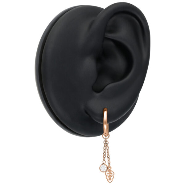 Aros en oro rosado con colgante de cristal en modelo de oreja negra