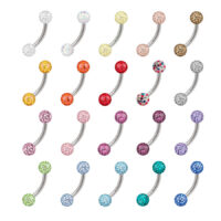 Varios Bananabells coloridos de titanio con cristales sobre fondo blanco