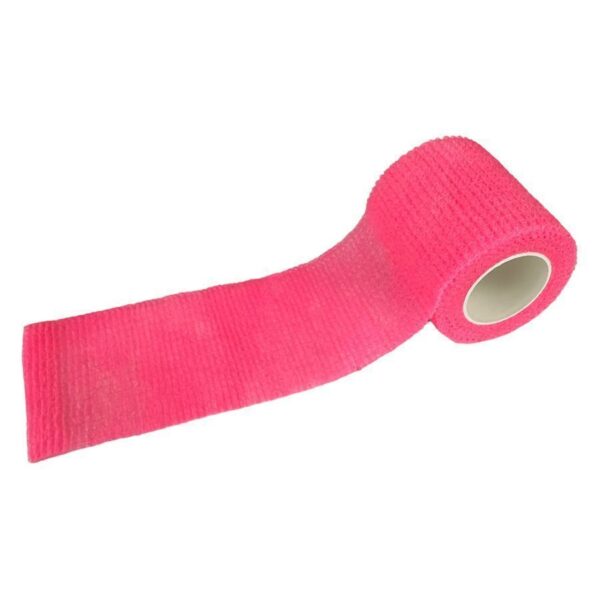Venda de agarre rosa de tela no tejida sobre fondo blanco