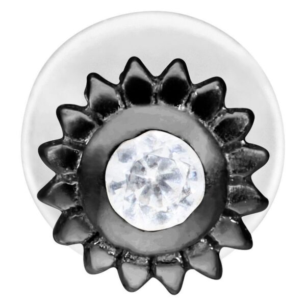 Labret negro con diseño en forma de flor y cristal claro sobre fondo blanco