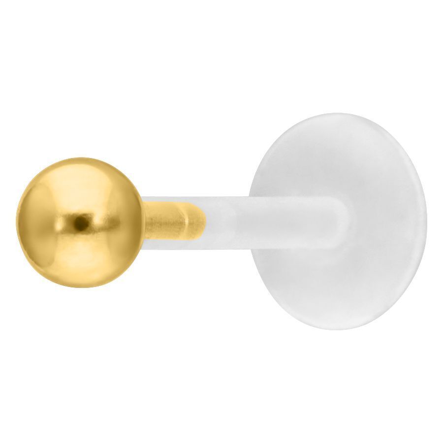 Piercing labret push-fit dorado con bola sobre fondo blanco