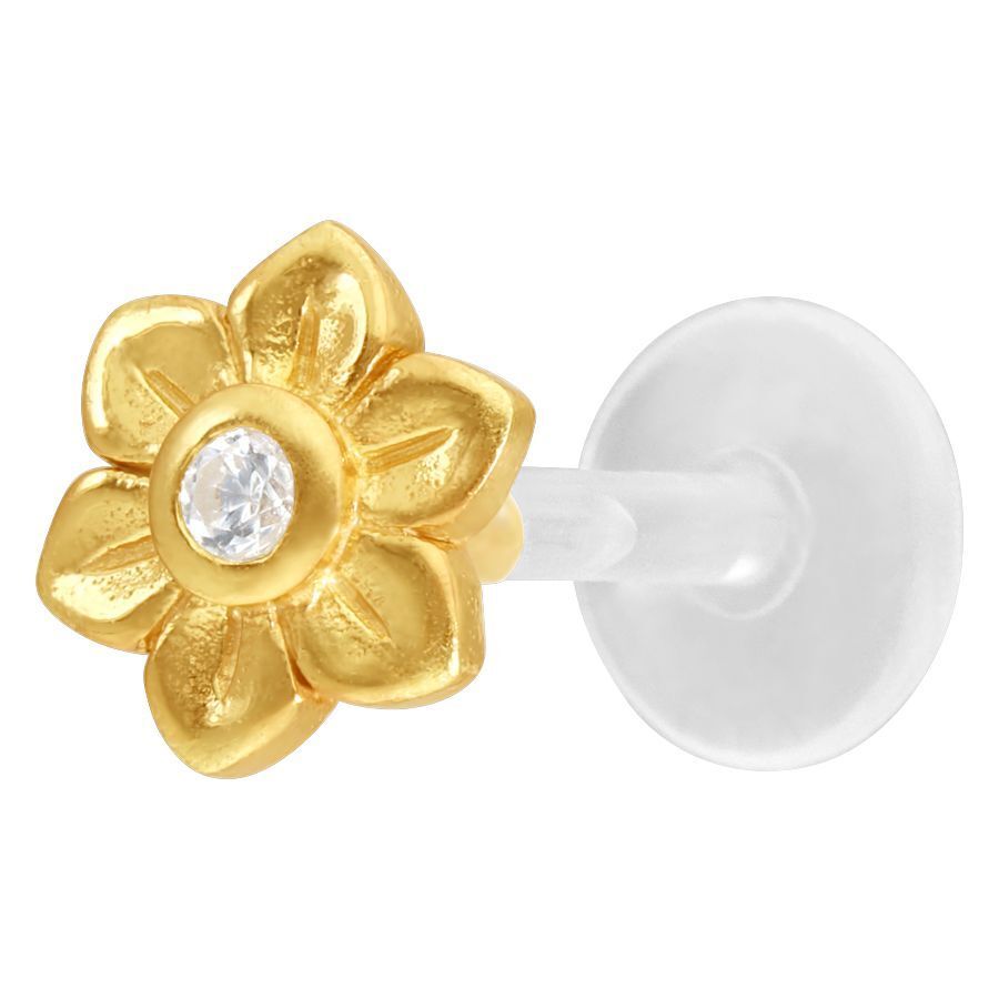 Labret dorado con adorno de flor y cristal claro sobre fondo blanco