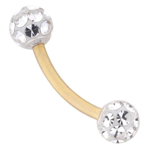 Piercing de ombligo dorado con dos bolas cristalinas sobre fondo blanco