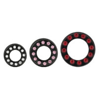 Schwarz Titan Tunnel mit Kristallen Drei schwarze Titan Tunnel mit klaren, rosa und roten Kristallen auf weißem Hintergrund