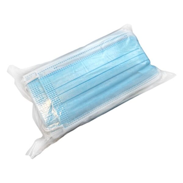 Pila de mascarillas faciales desechables azules en empaque transparente