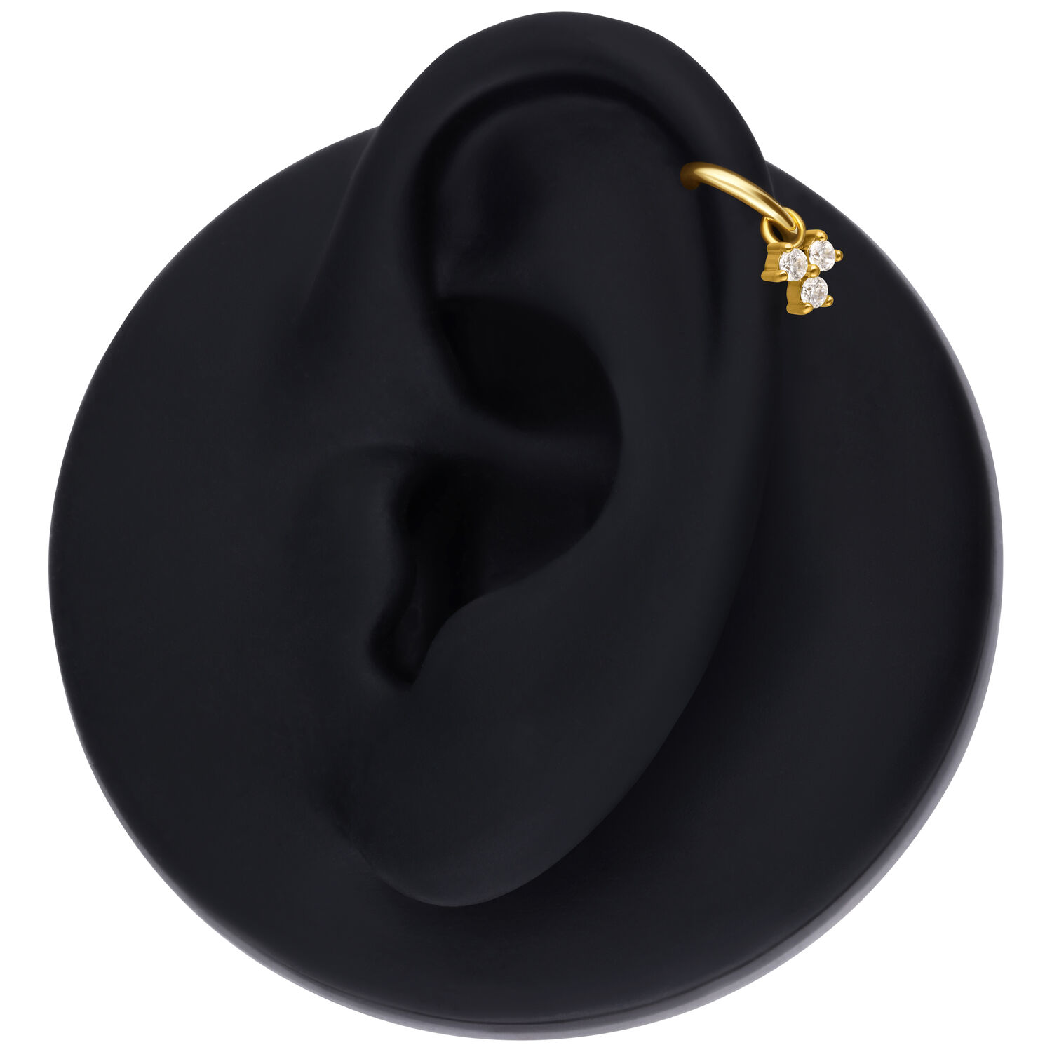 Colgante de piercing dorado con tres cristales en modelo de oreja negra