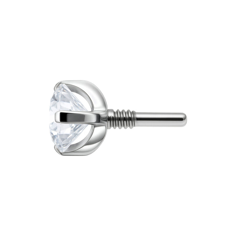 Pieza de piercing plateada con cristal claro, vista lateral sobre fondo blanco