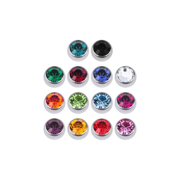 Bolas facetadas en plata con cristales en negro, claro, azul y fucsia sobre fondo blanco