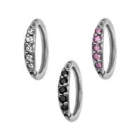 Tres Hinged Rings plateados con cristales negros, transparentes y rosas sobre fondo blanco
