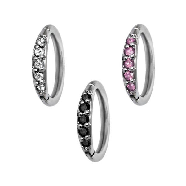 Tres Hinged Rings plateados con cristales negros, transparentes y rosas sobre fondo blanco