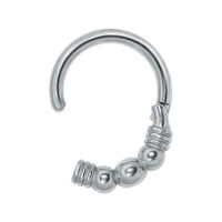 Clicker Esmeralda plateado con diseño de bolas sobre fondo blanco