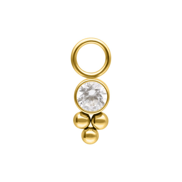 Colgante de piercing dorado con cristal sobre fondo blanco