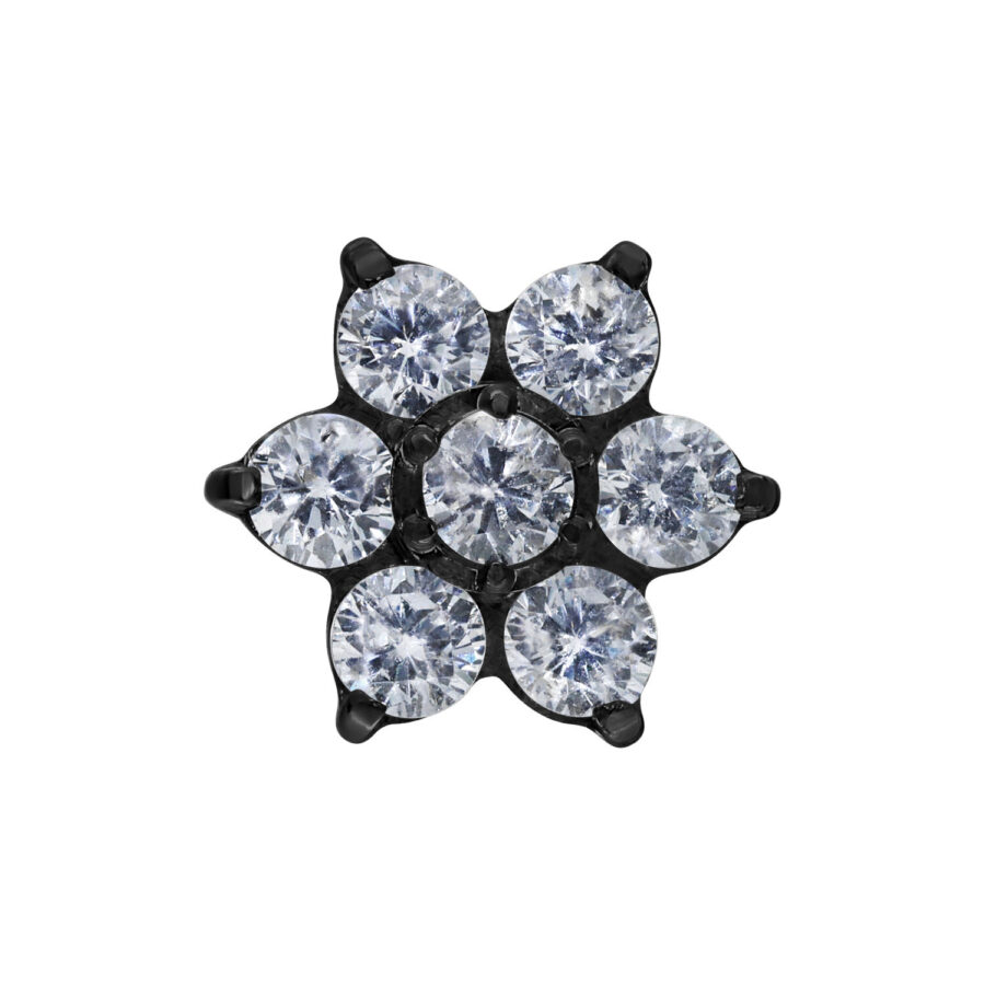 Tapa de flor negra con cristales claros sobre fondo blanco