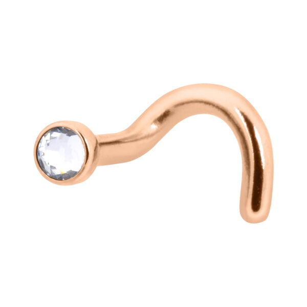 Piercing nasal de titanio rosado con cristal claro sobre fondo blanco