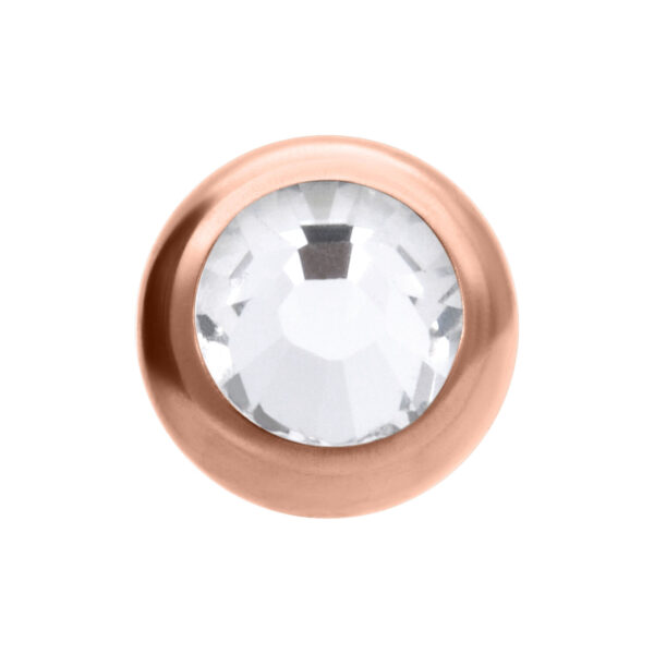Adorno redondo de piercing en oro rosado con cristal claro sobre fondo blanco