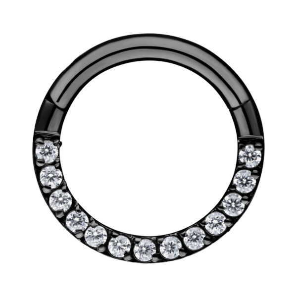 Clicker de septum negro con cristales sobre fondo blanco