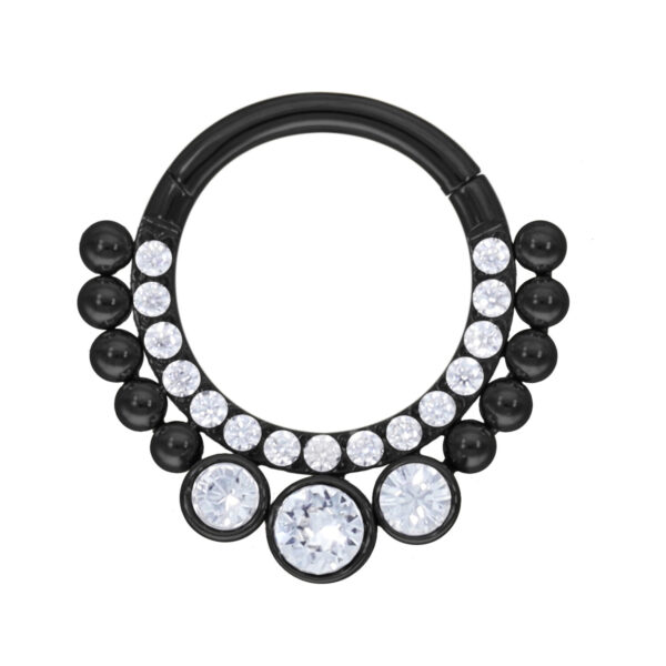 Clicker de septum negro con cristales claros sobre fondo blanco
