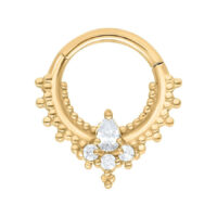 Aro de piercing dorado con cristales sobre fondo blanco