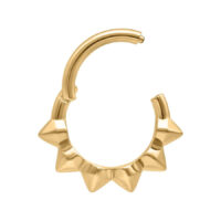 Aro de piercing dorado con diseño de espigas sobre fondo blanco