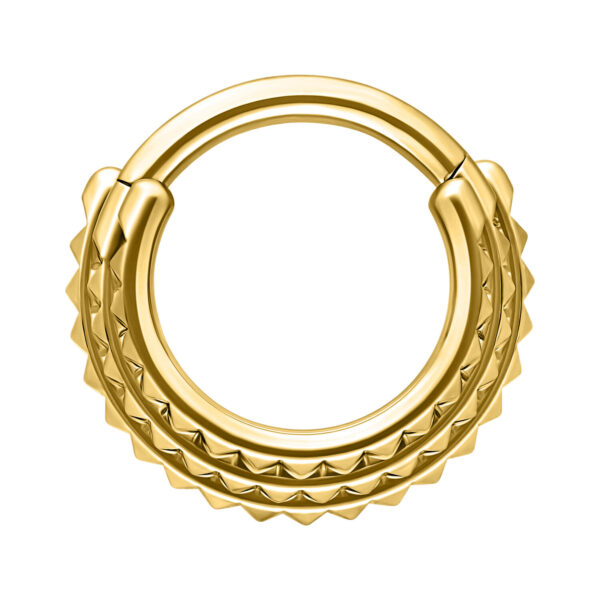 Clicker de Septum dorado con triples spikes sobre fondo blanco