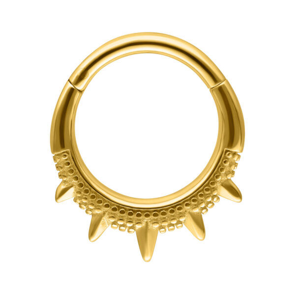 Clicker de septum dorado con puntas orientales sobre fondo blanco
