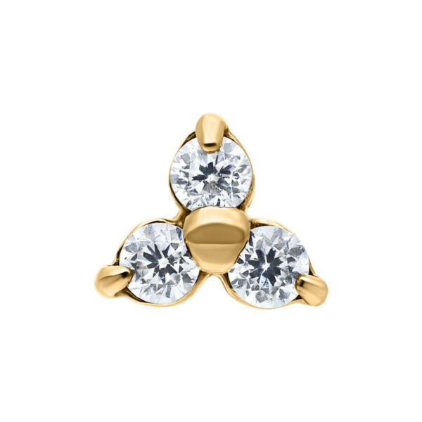 Accesorio Dermal dorado con tres cristales claros sobre fondo blanco