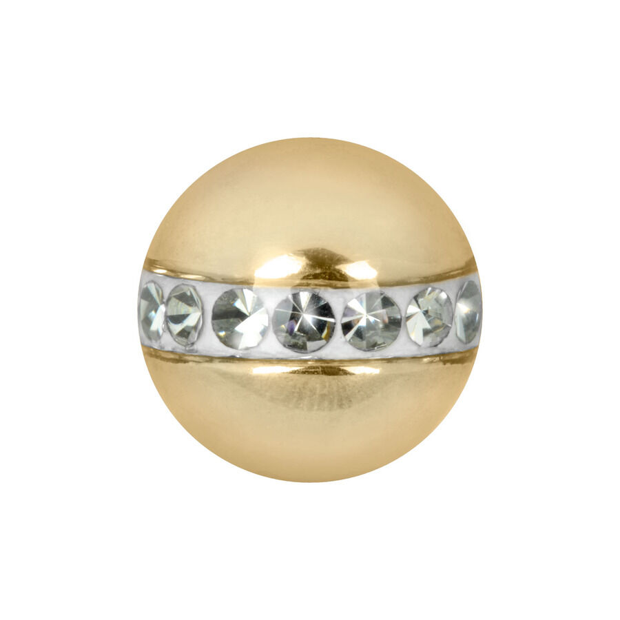 Accesorio de piercing dorado con cristales Accesorio dorado para piercings con cristales claros sobre fondo blanco