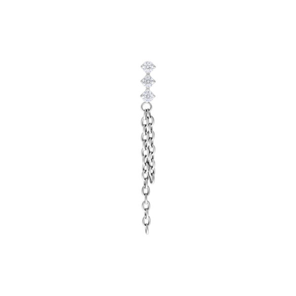 Accesorio de piercing plateado con tres cristales claros y cadenas colgantes sobre fondo blanco