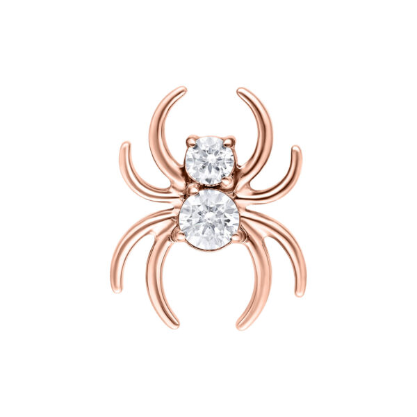 Accesorio de araña en oro rosado con cristales claros sobre fondo blanco