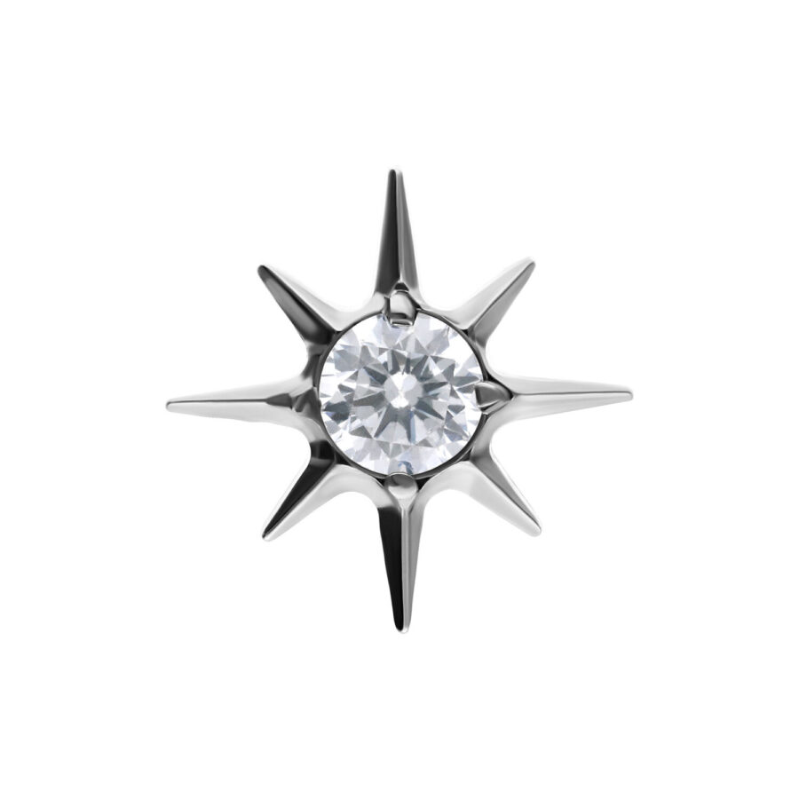 Accesorio en forma de estrella plateada con cristal claro sobre fondo blanco