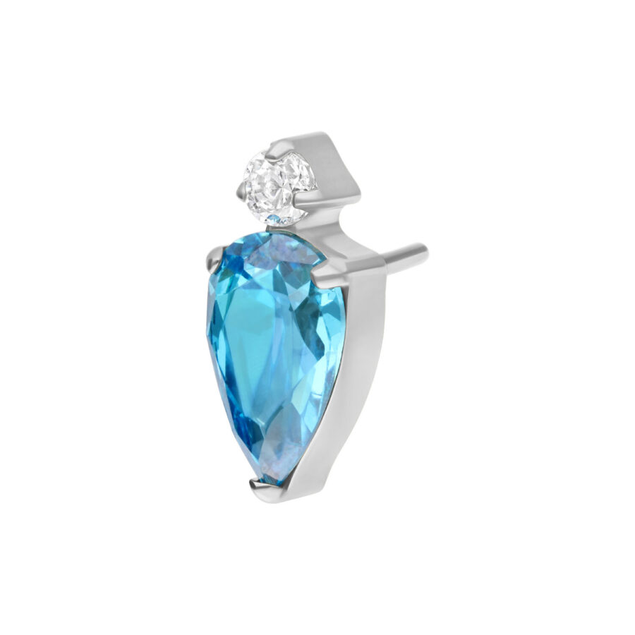 Accesorio de titanio con cristal turquesa y marco plateado sobre fondo blanco