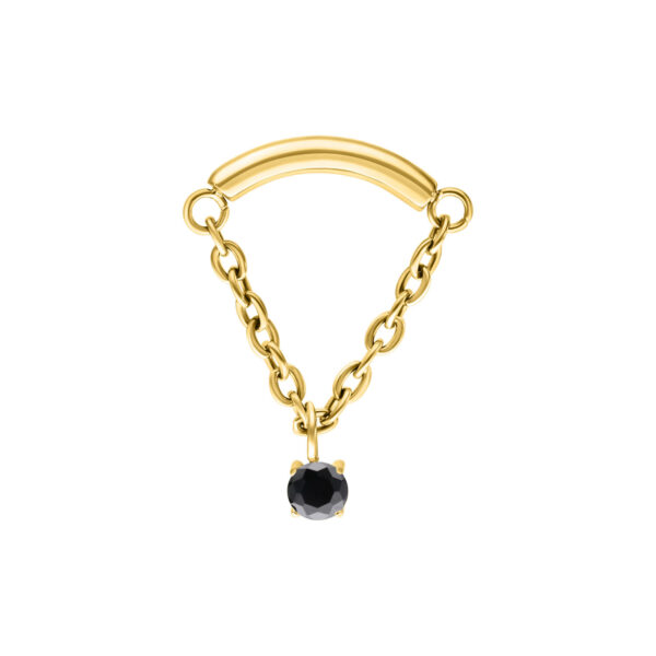 Accesorio de piercing dorado con cristal negro sobre fondo blanco