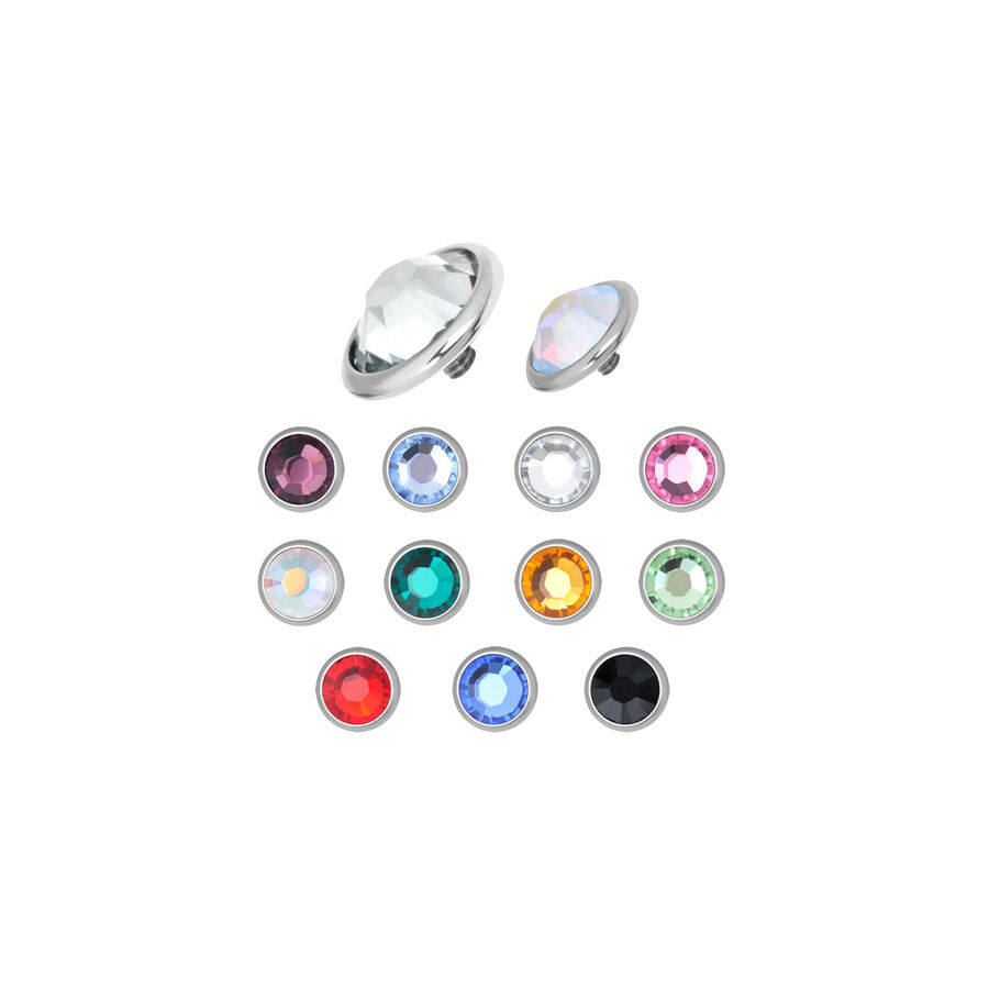 Accesorios de titanio plateados con cristales de colores sobre fondo blanco