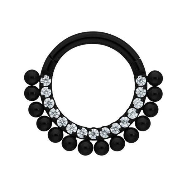 Clicker de titanio negro con piedras cristalinas y bolas sobre fondo blanco
