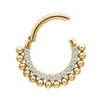 Piercing Clicker de Cristal Little Balls Dorado Piercing de titanio dorado con cristales claros sobre fondo blanco
