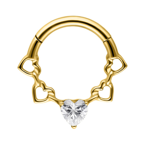 Clicker de septum dorado con corazón de cristal sobre fondo blanco