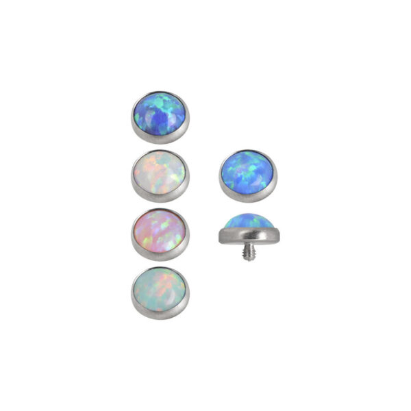 Seis accesorios de anclaje dermal de ópalo en diferentes colores sobre fondo blanco