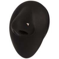 Piercing de nariz en oro rosa con cristales transparentes sobre display negro